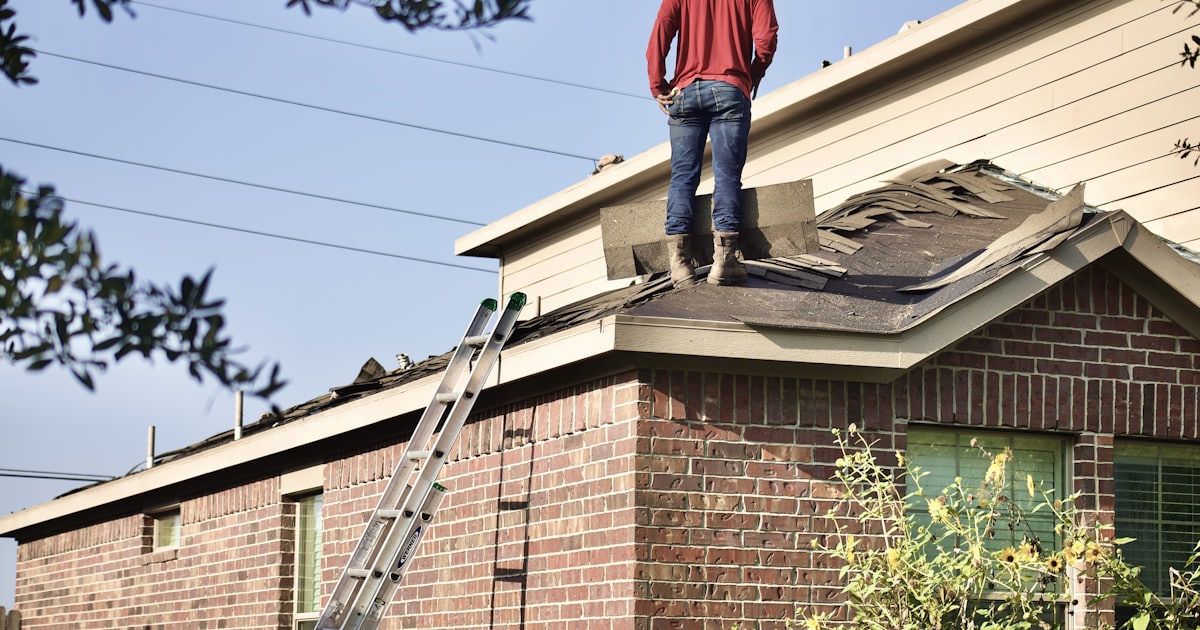 Roof damage being evaluated during an insurance claim inspection