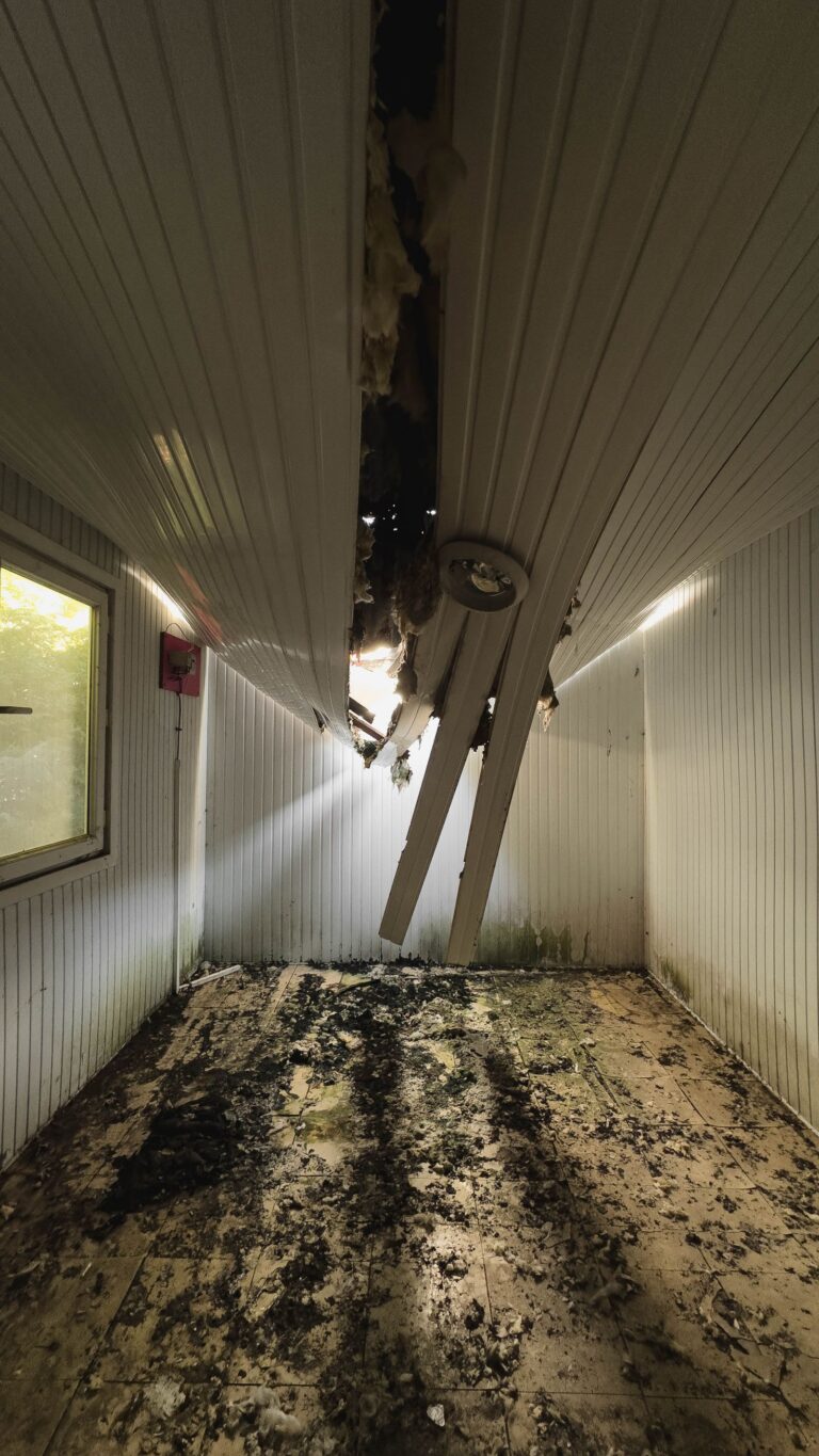 Interior room with water damaged collapsed ceiling
