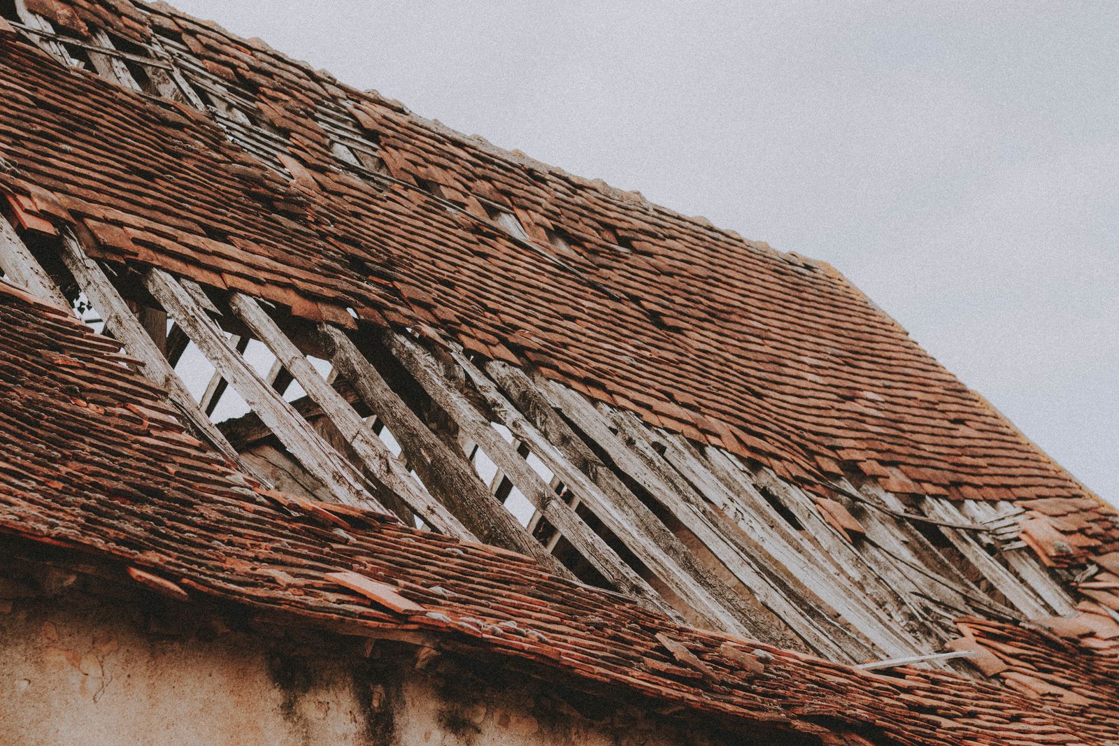 Roof with missing shingles from wind and storm damage